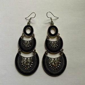 Pair of fashion earrings in black and chrome.